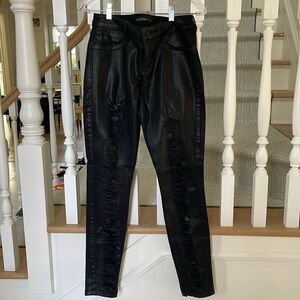 Black coated ripped skinny jeans